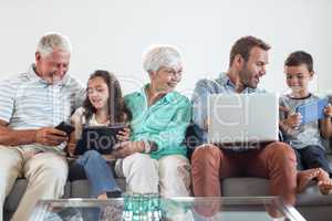 Happy family sitting on sofa