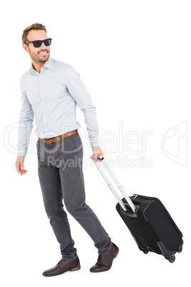 Young man with trolley bag