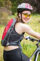 Smiling woman cycling