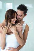 Happy man embracing beautiful wife