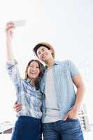 Happy young couple taking a selfie