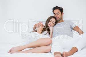 Young couple relaxing on bed