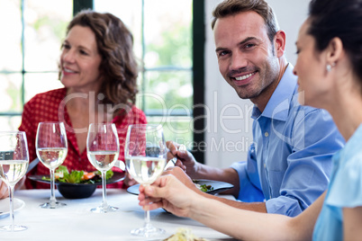 Portrait of man having lunch with his friends