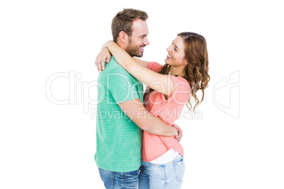 Happy young couple cuddling each other