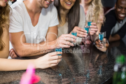 Group of friends having shots