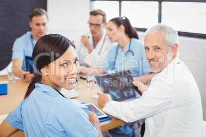 Portrait of doctors smiling in conference room