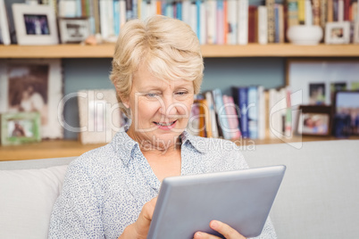 Senior woman using digital tablet at home Senior woman using digital tablet at home