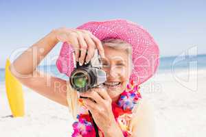 Senior woman taking picture