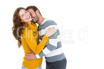 Happy young couple cuddling