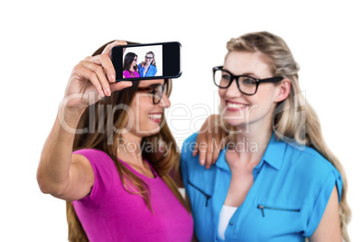 Happy female friends taking self portrait