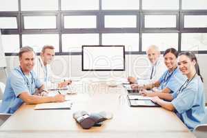 Portrait of happy medical team in conference room