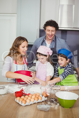Family cooking food in kitchen