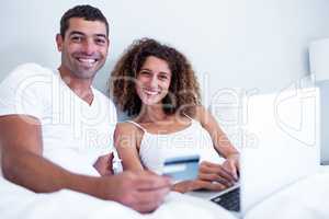 Portrait of couple shopping online