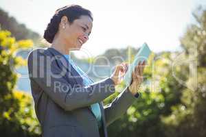 Pretty businesswoman using tablet