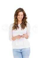 Happy young woman text messaging on mobile phone