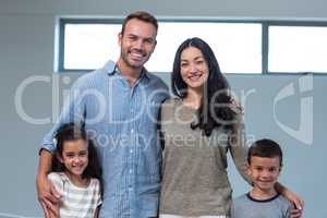 Family standing together and smiling