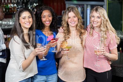 Friends drinking cocktails together