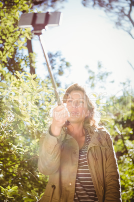 Smiling woman taking selfies