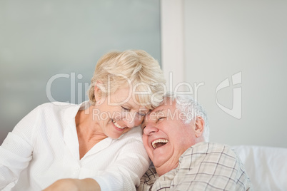 Happy senior couple laughing