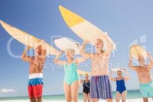 Senior friends holding surfboard