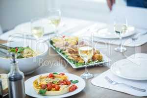 Food and wine served on table