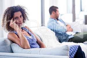 Upset young couple ignoring each other