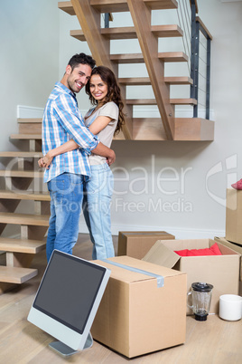 Portrait of cheerful couple hugging