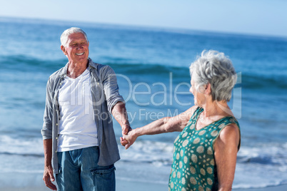 Senior couple holding hands