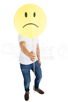 Man holding sad smiley face