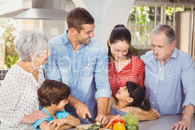 Happy family preparing food in kitchen