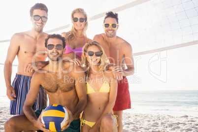 Smiling friends after playing volleyball