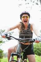 Woman shouting while cycling