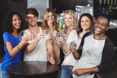 Group of friends having shots