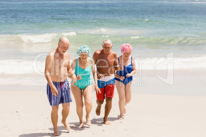 Senior friends getting out of water