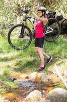 Woman carrying her bike