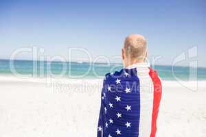 Senior man holding american flag