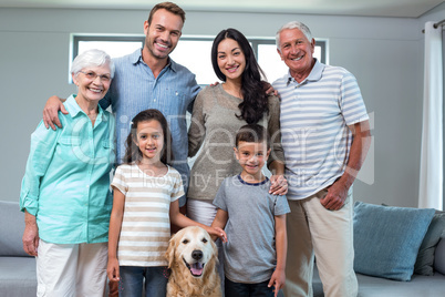 Family standing together with dog