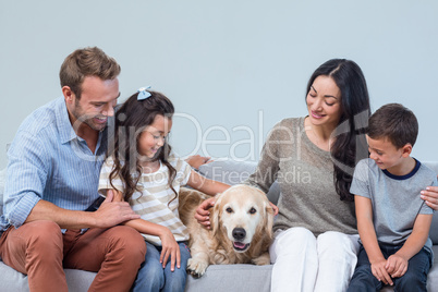 Family with dog in living room