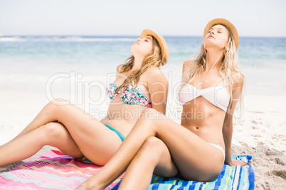 Two pretty women relaxing on the beach