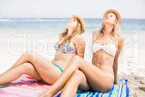 Two pretty women relaxing on the beach
