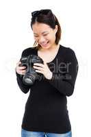 Woman looking at picture on digital camera