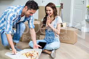 Cheerful couple having pizza