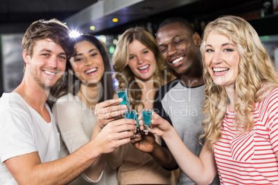 Friends toasting with shots