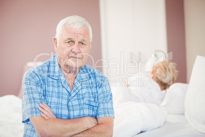 Portrait of senior man sitting at home