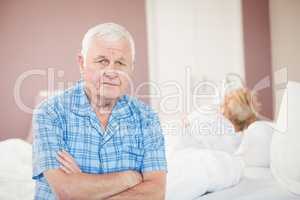 Portrait of senior man sitting at home