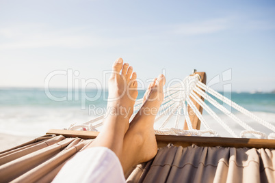 Woman lying in hammock