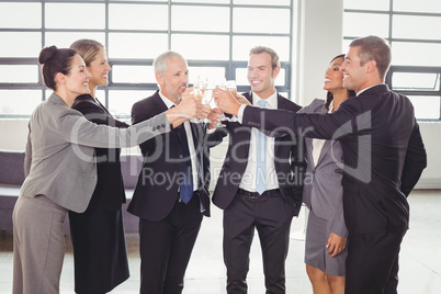 Team of businesspeople toasting champagne