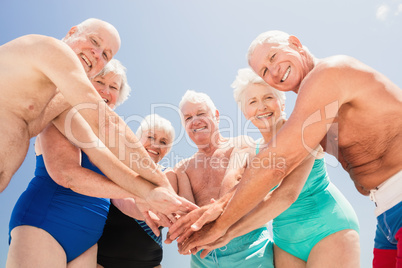 Senior friends cheering together