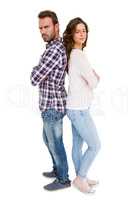 Depressed couple standing back to back