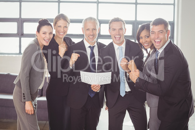 Team of businesspeople with certificate